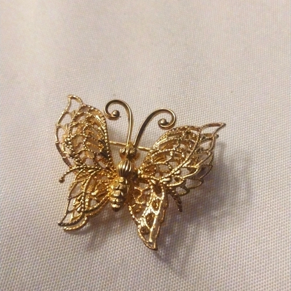 Women's gold tone butterfly brooch